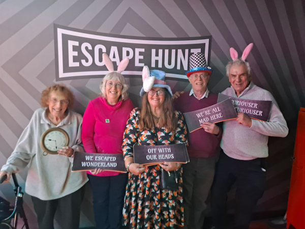 older adults in bunny ears successfully completed escape room challenge